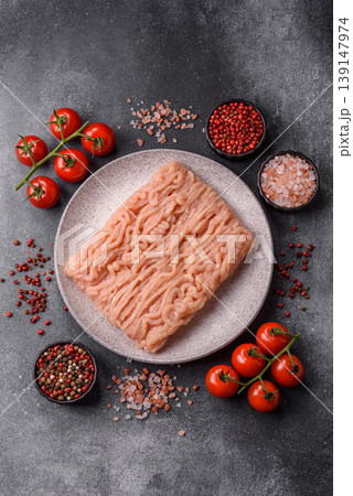 Raw fresh ground chicken, turkey, or pork for burgers or meatballs. Raw ground chicken Raw fresh ground chicken, turkey, or pork for burgers or meatballs. Raw ground chicken 139147974