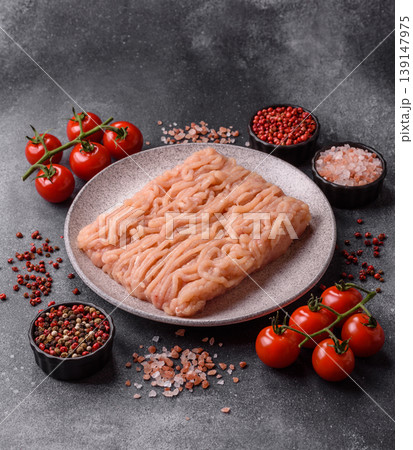 Raw fresh ground chicken, turkey, or pork for burgers or meatballs. Raw ground chicken Raw fresh ground chicken, turkey, or pork for burgers or meatballs. Raw ground chicken 139147975