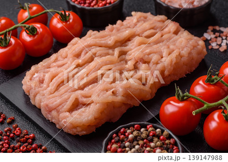 Raw fresh ground chicken, turkey, or pork for burgers or meatballs. Raw ground chicken Raw fresh ground chicken, turkey, or pork for burgers or meatballs. Raw ground chicken 139147988