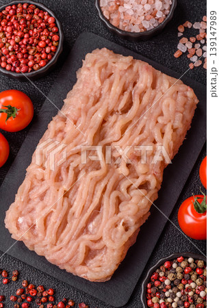 Raw fresh ground chicken, turkey, or pork for burgers or meatballs. Raw ground chicken Raw fresh ground chicken, turkey, or pork for burgers or meatballs. Raw ground chicken 139147989