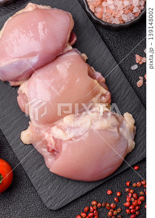 Raw chicken thigh fillet, boneless and skinless, for roasting. Raw thigh fillet Raw chicken thigh fillet, boneless and skinless, for roasting. Raw thigh fillet 139148002