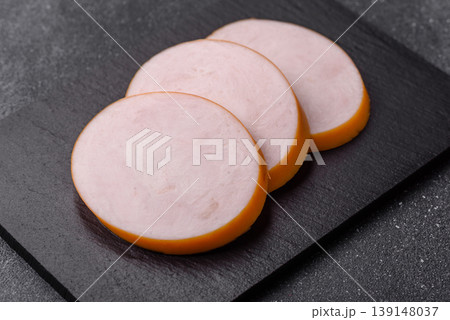 Chicken or Indian cooked sausage or ham sliced for breakfast sandwiches. Chicken sausage slices Chicken or Indian cooked sausage or ham sliced for breakfast sandwiches. Chicken sausage slices 139148037