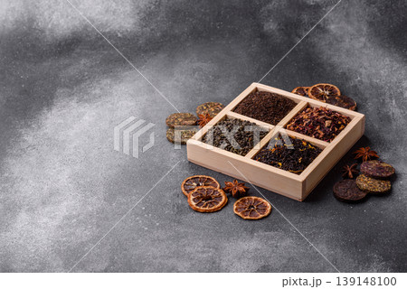 A box of various dry teas, black, green, herbal, and fruit. A set of different tea varieties A box of various dry teas, black, green, herbal, and fruit. A set of different tea varieties 139148100