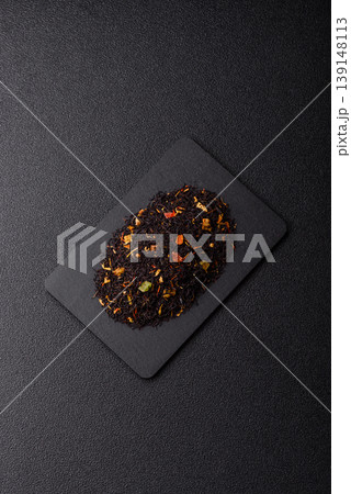 Dry black tea with herbal leaves and aromatic additives. Dry fruity black tea Dry black tea with herbal leaves and aromatic additives. Dry fruity black tea 139148113