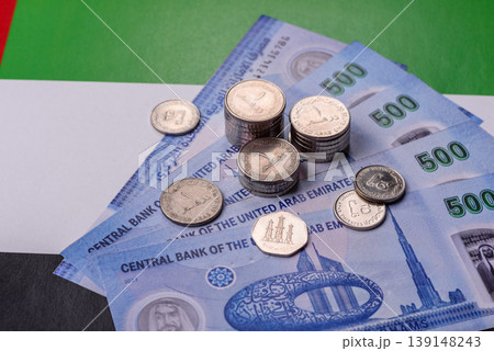 United Arab Emirates cash, dirhams and coins for exchange and financial transactions. UAE currency United Arab Emirates cash, dirhams and coins for exchange and financial transactions. UAE currency 139148243