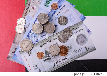 United Arab Emirates cash, dirhams and coins for exchange and financial transactions. UAE currency 139148247