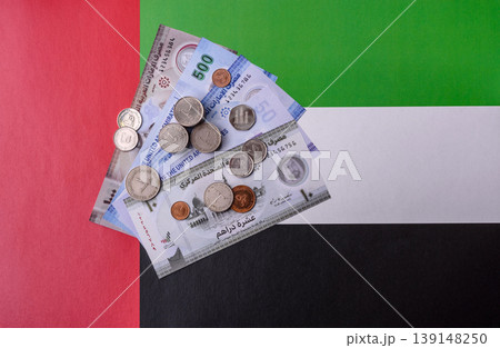 United Arab Emirates cash, dirhams and coins for exchange and financial transactions. UAE currency United Arab Emirates cash, dirhams and coins for exchange and financial transactions. UAE currency 139148250