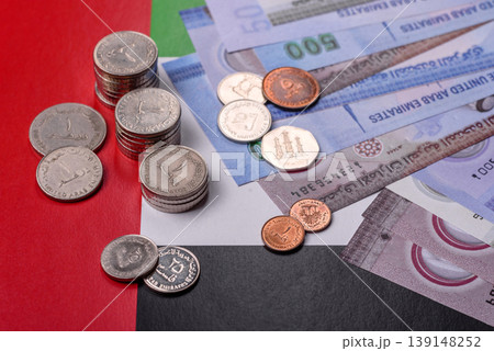 United Arab Emirates cash, dirhams and coins for exchange and financial transactions. UAE currency United Arab Emirates cash, dirhams and coins for exchange and financial transactions. UAE currency 139148252
