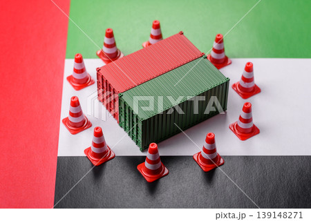 The cargo container ban on the uae flag as a conceptual backdrop. The cargo container embargo 139148271