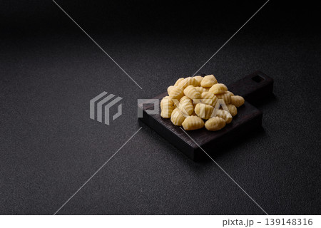 Raw homemade potato gnocchi, made with salt and spices, ready for lunch. Raw gnocchi 139148316