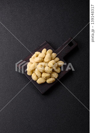 Raw homemade potato gnocchi, made with salt and spices, ready for lunch. Raw gnocchi 139148317