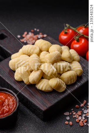 Raw homemade potato gnocchi, made with salt and spices, ready for lunch. Raw gnocchi 139148324