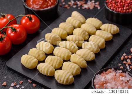 Raw homemade potato gnocchi, made with salt and spices, ready for lunch. Raw gnocchi 139148331