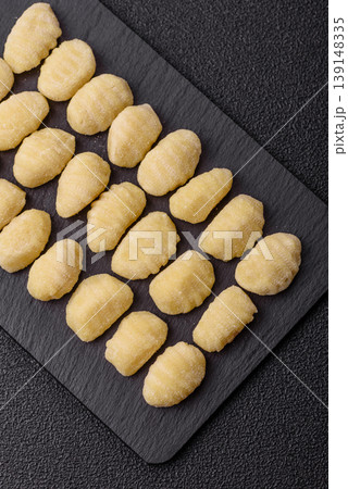 Raw homemade potato gnocchi, made with salt and spices, ready for lunch. Raw gnocchi 139148335