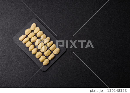 Raw homemade potato gnocchi, made with salt and spices, ready for lunch. Raw gnocchi 139148338