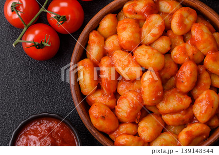 Homemade potato gnocchi with Bolognese sauce, seasoned with salt and spices. Gnocchi with sauce Homemade potato gnocchi with Bolognese sauce, seasoned with salt and spices. Gnocchi with sauce 139148344
