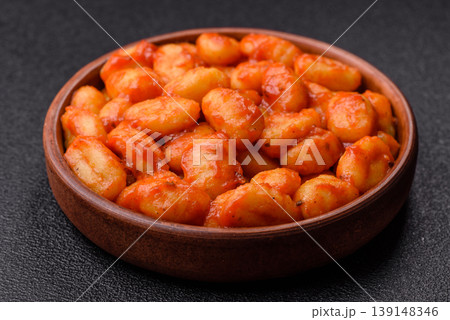 Homemade potato gnocchi with Bolognese sauce, seasoned with salt and spices. Gnocchi with sauce Homemade potato gnocchi with Bolognese sauce, seasoned with salt and spices. Gnocchi with sauce 139148346