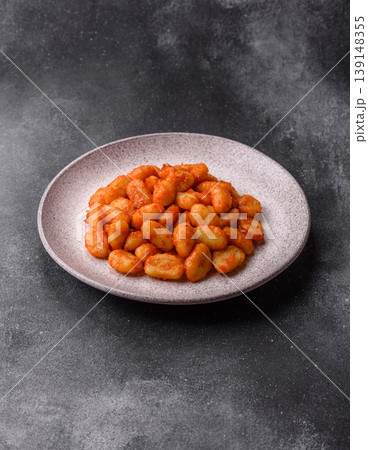 Homemade potato gnocchi with Bolognese sauce, seasoned with salt and spices. Gnocchi with sauce Homemade potato gnocchi with Bolognese sauce, seasoned with salt and spices. Gnocchi with sauce 139148355