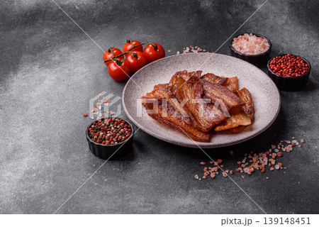 Fried fresh bacon slices with layers of meat or prosciutto prepared for breakfast. Fried bacon Fried fresh bacon slices with layers of meat or prosciutto prepared for breakfast. Fried bacon 139148451