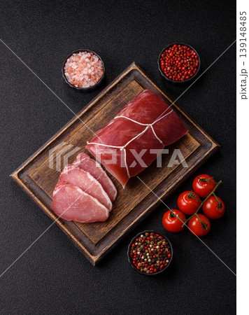 Smoked or dry cured meat slices, pork or ham with salt and spices. Smoked meat slices Smoked or dry cured meat slices, pork or ham with salt and spices. Smoked meat slices 139148485