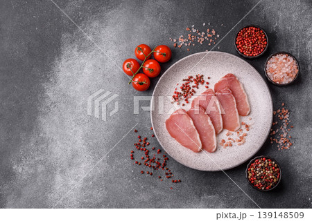 Smoked or dry cured meat slices, pork or ham with salt and spices. Smoked meat slices 139148509