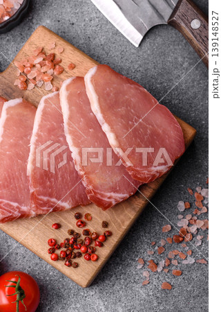 Smoked or dry cured meat slices, pork or ham with salt and spices. Smoked meat slices 139148527