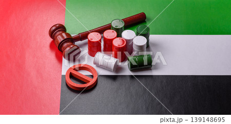 The cargo container ban on the UAE flag as a conceptual backdrop . The cargo container embargo The cargo container ban on the UAE flag as a conceptual backdrop . The cargo container embargo 139148695