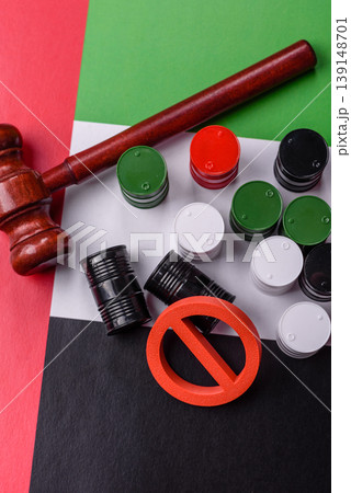 The cargo container ban on the UAE flag as a conceptual backdrop . The cargo container embargo The cargo container ban on the UAE flag as a conceptual backdrop . The cargo container embargo 139148701