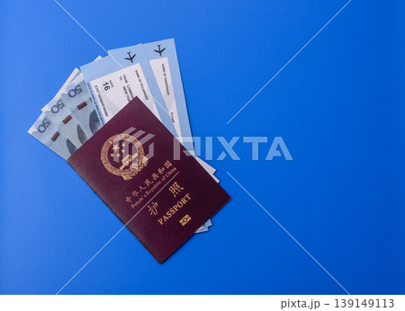 China, Chinese passport with money and flight tickets. Chinese passport 139149113
