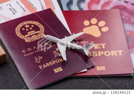 China, Chinese passport with money and flight tickets. Chinese passport 139149125