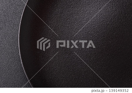 An empty ceramic round plate, kitchen utensils for a dinner table. An empty plate An empty ceramic round plate, kitchen utensils for a dinner table. An empty plate 139149352