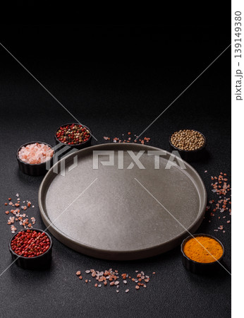 An empty ceramic round plate, kitchen utensils for a dinner table. An empty plate An empty ceramic round plate, kitchen utensils for a dinner table. An empty plate 139149380