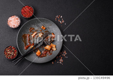A dirty plate after a meal with leftover pasta and tomato sauce, cleaning. An empty dirty plate A dirty plate after a meal with leftover pasta and tomato sauce, cleaning. An empty dirty plate 139149496