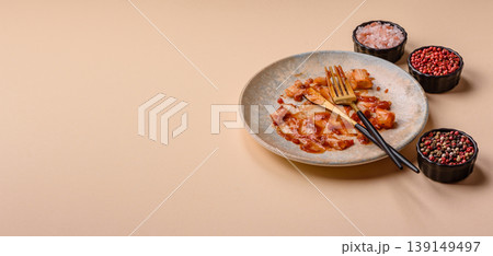 A dirty plate after a meal with leftover pasta and tomato sauce, cleaning. An empty dirty plate A dirty plate after a meal with leftover pasta and tomato sauce, cleaning. An empty dirty plate 139149497