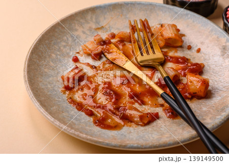 A dirty plate after a meal with leftover pasta and tomato sauce, cleaning. An empty dirty plate A dirty plate after a meal with leftover pasta and tomato sauce, cleaning. An empty dirty plate 139149500