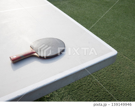 Table Tennis Paddle On Outdoor Ping Pong Table 139149946