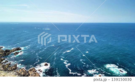 Aerial views of a stunning coastal landscape with rocky shoreline 139150030