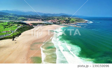 Aerial footage shows a stunning beach with majestic mountains Aerial footage shows a stunning beach with majestic mountains 139150096