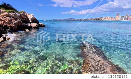 Stunning Scenic Coastal View Showcasing Crystal Clear Water and Rocky Shoreline Beauty Stunning Scenic Coastal View Showcasing Crystal Clear Water and Rocky Shoreline Beauty 139150131