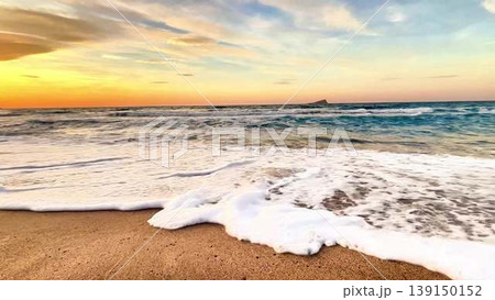 Experience the Serene Sunset Waves on the Sandy Beach, a perfect paradise destination Experience the Serene Sunset Waves on the Sandy Beach, a perfect paradise destination 139150152