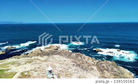 Explore a scenic coastal view with waves crashing on a rocky shoreline, revealing beauty Explore a scenic coastal view with waves crashing on a rocky shoreline, revealing beauty 139150163