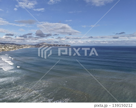 Coastal aerial view, Seaside landscape from above, Drone captures sweeping ocean shoreline scene 139150212