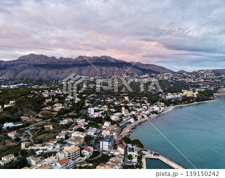 Serene coastal sunset, Tranquil seaside view at dusk, Calm ocean horizon with peaceful seaside scene Serene coastal sunset, Tranquil seaside view at dusk, Calm ocean horizon with peaceful seaside scene 139150242