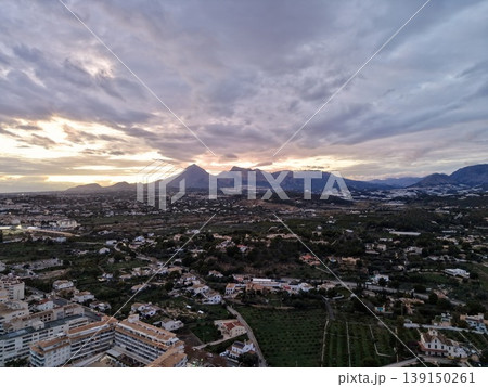 Sunset over valley countryside, Picturesque aerial shot of rural scenery at dusk with vibrant colors 139150261
