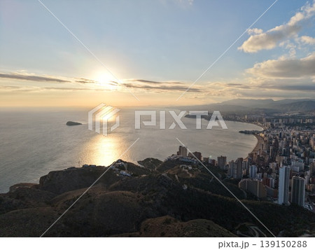 Sunlit ocean scene, Peaceful waters reflecting sunlight beneath soft cloud cover and distant horizon Sunlit ocean scene, Peaceful waters reflecting sunlight beneath soft cloud cover and distant horizon 139150288
