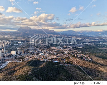 Urban growth landscape, City expansion with mountain view, Sprawling cityscape against mountain and bay 139150296