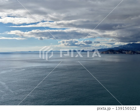 Scenic coastal cityscape with cliffs, Picturesque seaside town framed by rugged cliffs and peaceful water 139150322