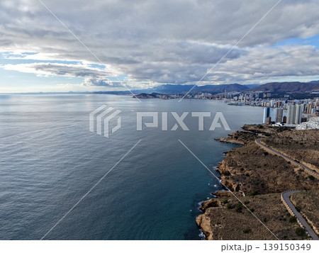 Elevated rocky precipice featuring winding routes and panoramic ocean scenery perfect for adventurers Elevated rocky precipice featuring winding routes and panoramic ocean scenery perfect for adventurers 139150349