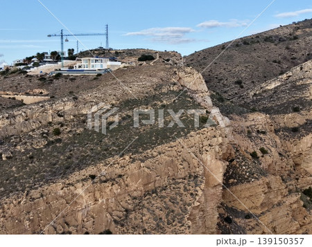 Construction operation on rocky promontory blending natural scenery with built environment 139150357