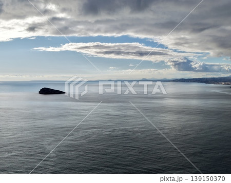 Calm horizon with gentle cloud images, Peaceful ocean scene featuring soft clouds and subtle lighting 139150370